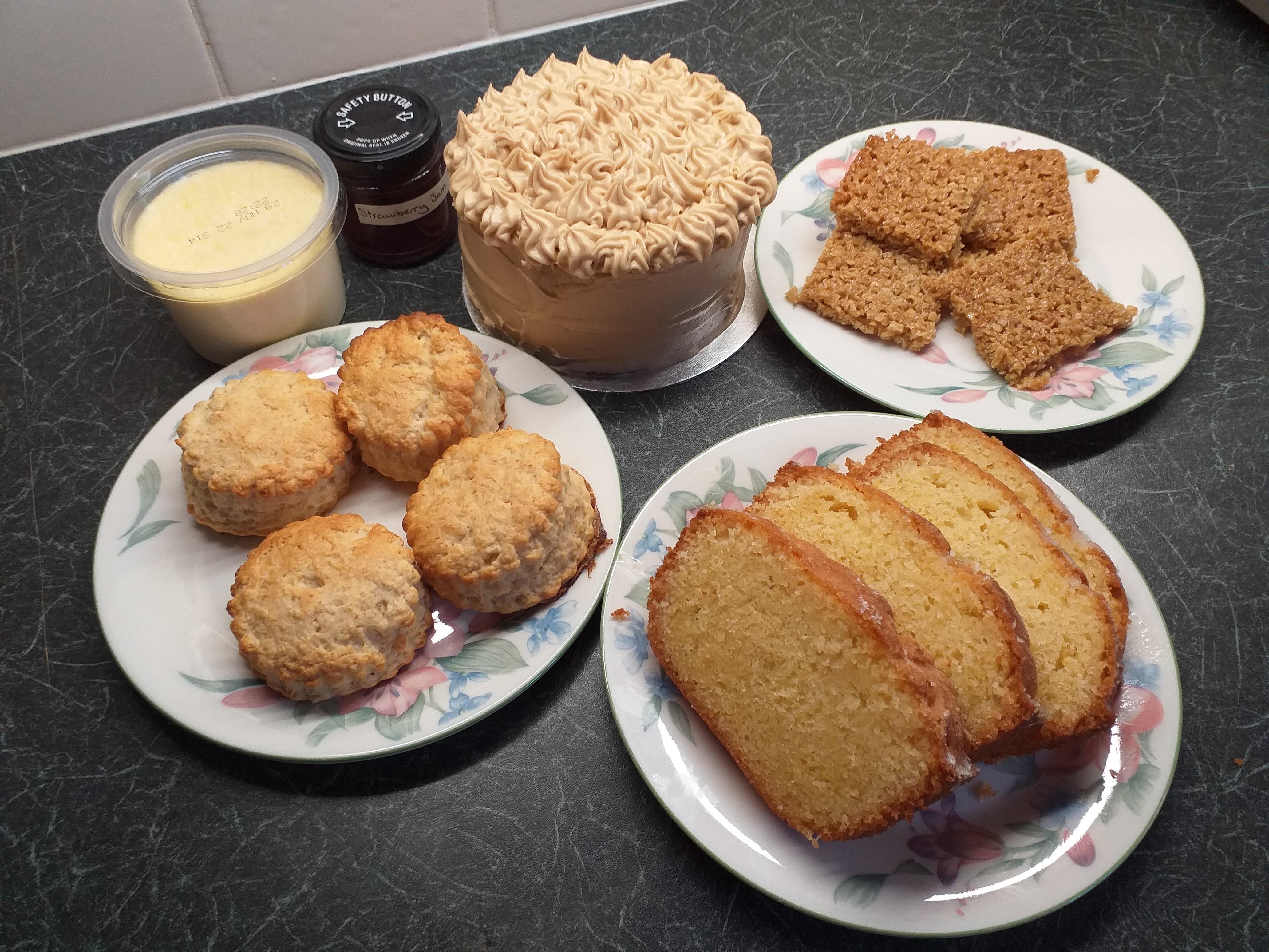 A range of amazing bakes including scones, lemon cake, flapjacks, and walnut cake.